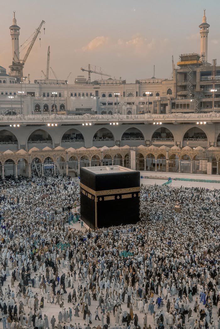 High-angle view of pilgrims around the Kaaba in Mecca, Saudi Arabia at sunset.